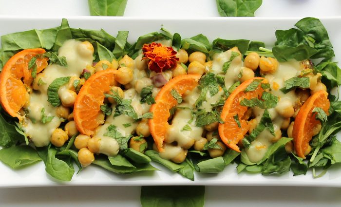 Clarity Chickpea Spinach Salad with Cumin Yogurt Orange Dressing.