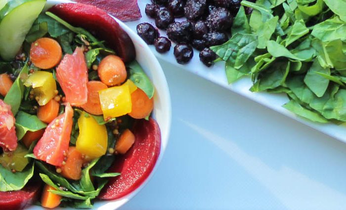 Optimism Rainbow Spinach Avocado Salad.